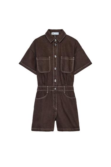 Front view of a short brown jumpsuit with a shirt collar, short sleeves, front pockets, and a zip and button fastening.