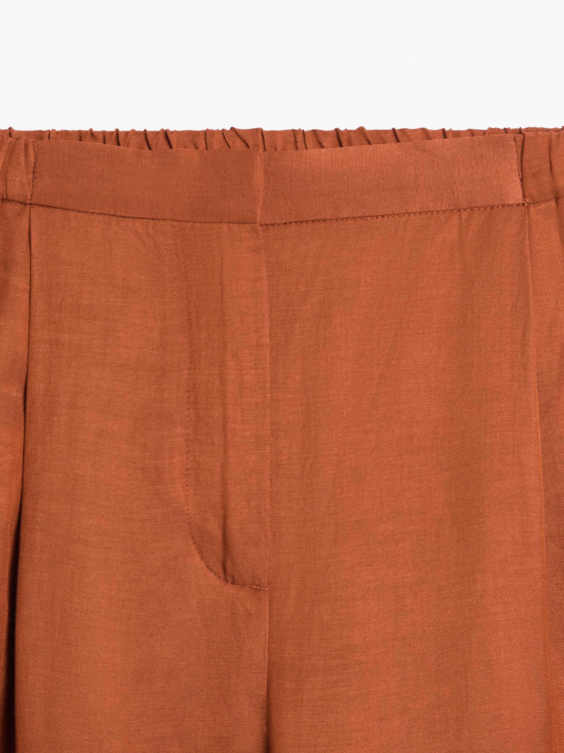 Flowing trousers with tie detail