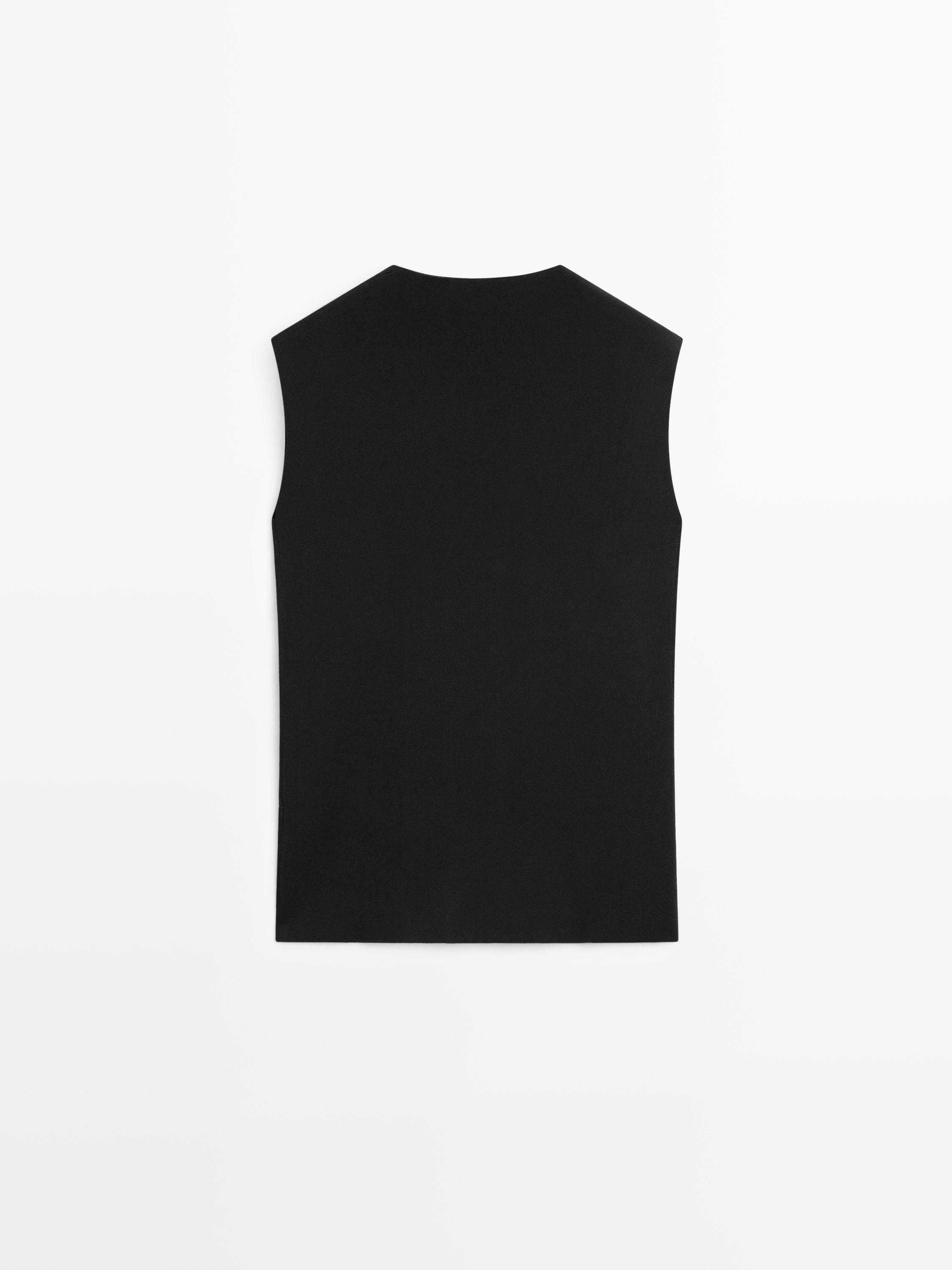 Long double-breasted vest