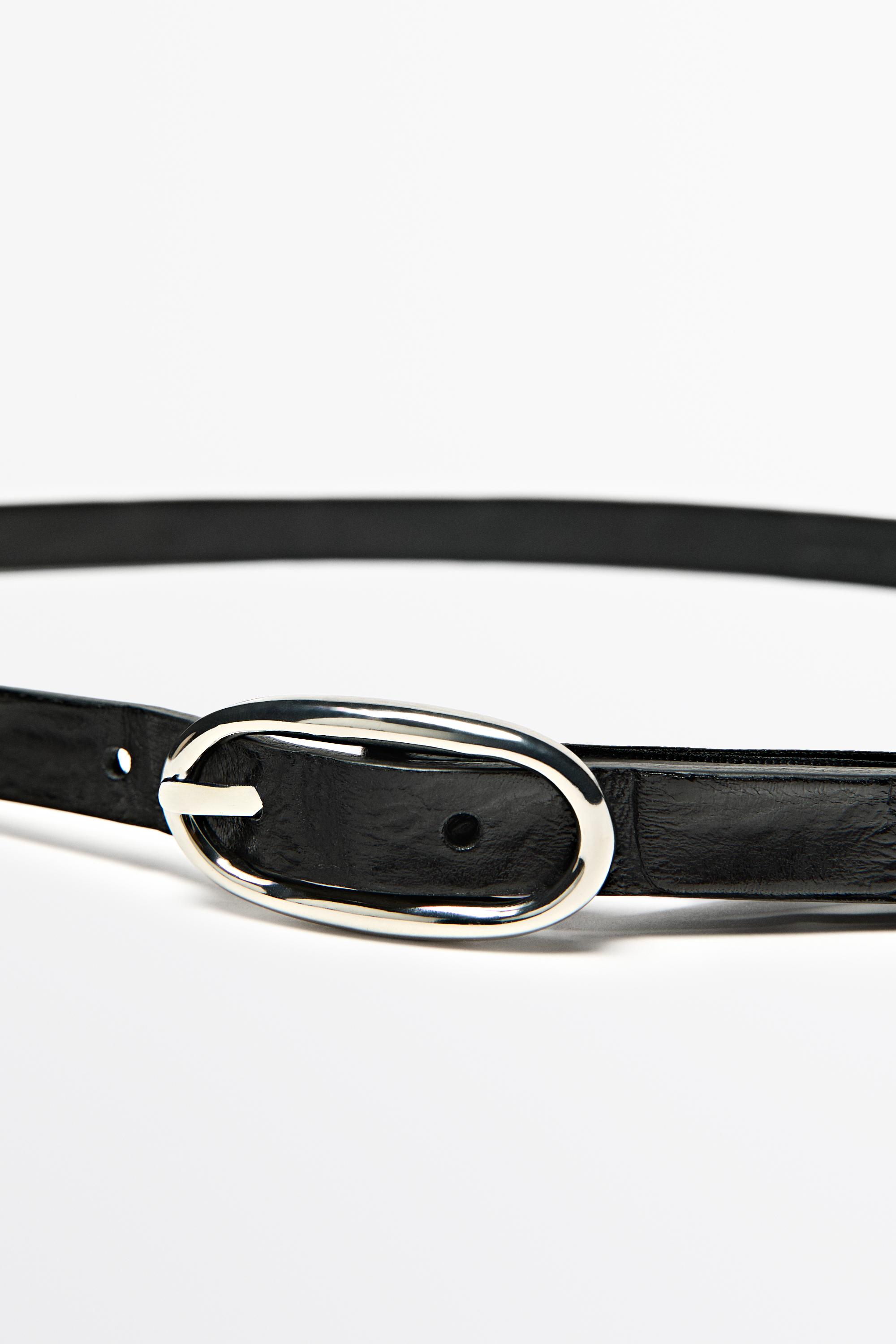 Leather belt with oval buckle and textured finish