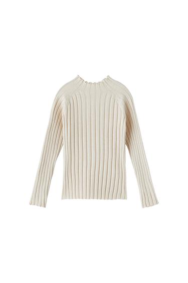 Front view of a beige ribbed knit sweater with long sleeves and a crew neck.