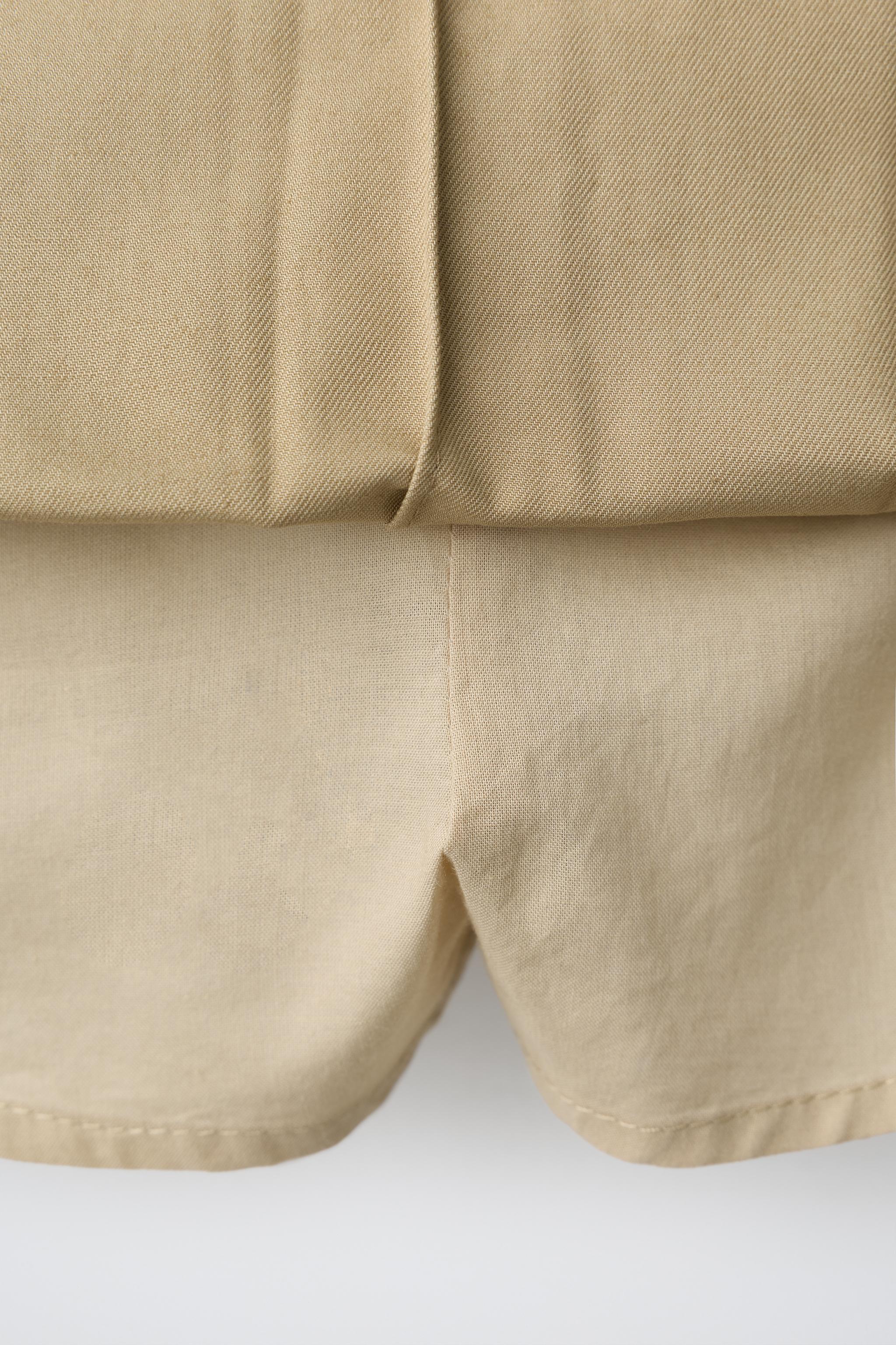 SOLID PLEATED SKIRT