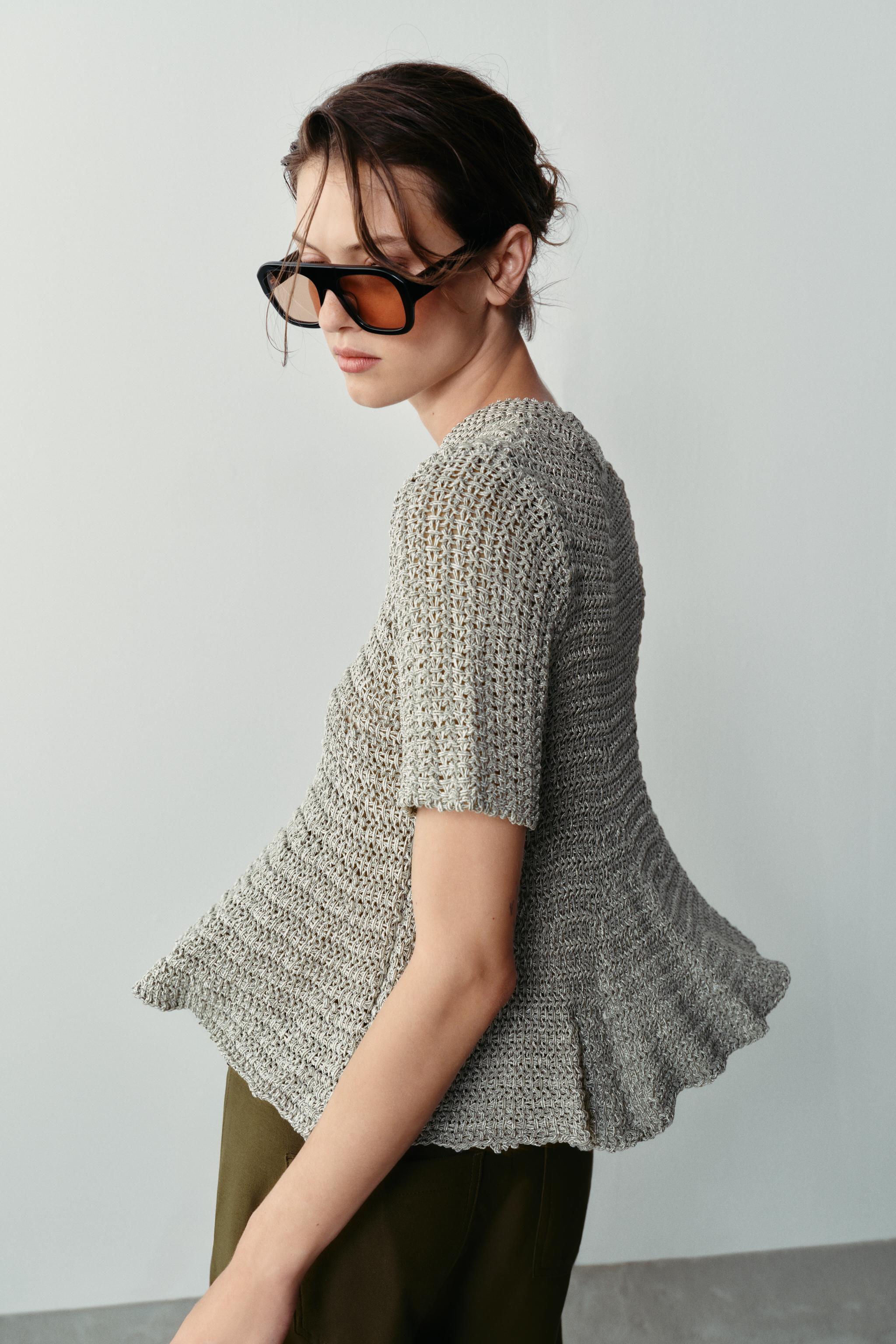 OPEN-KNIT PEPLUM TOP