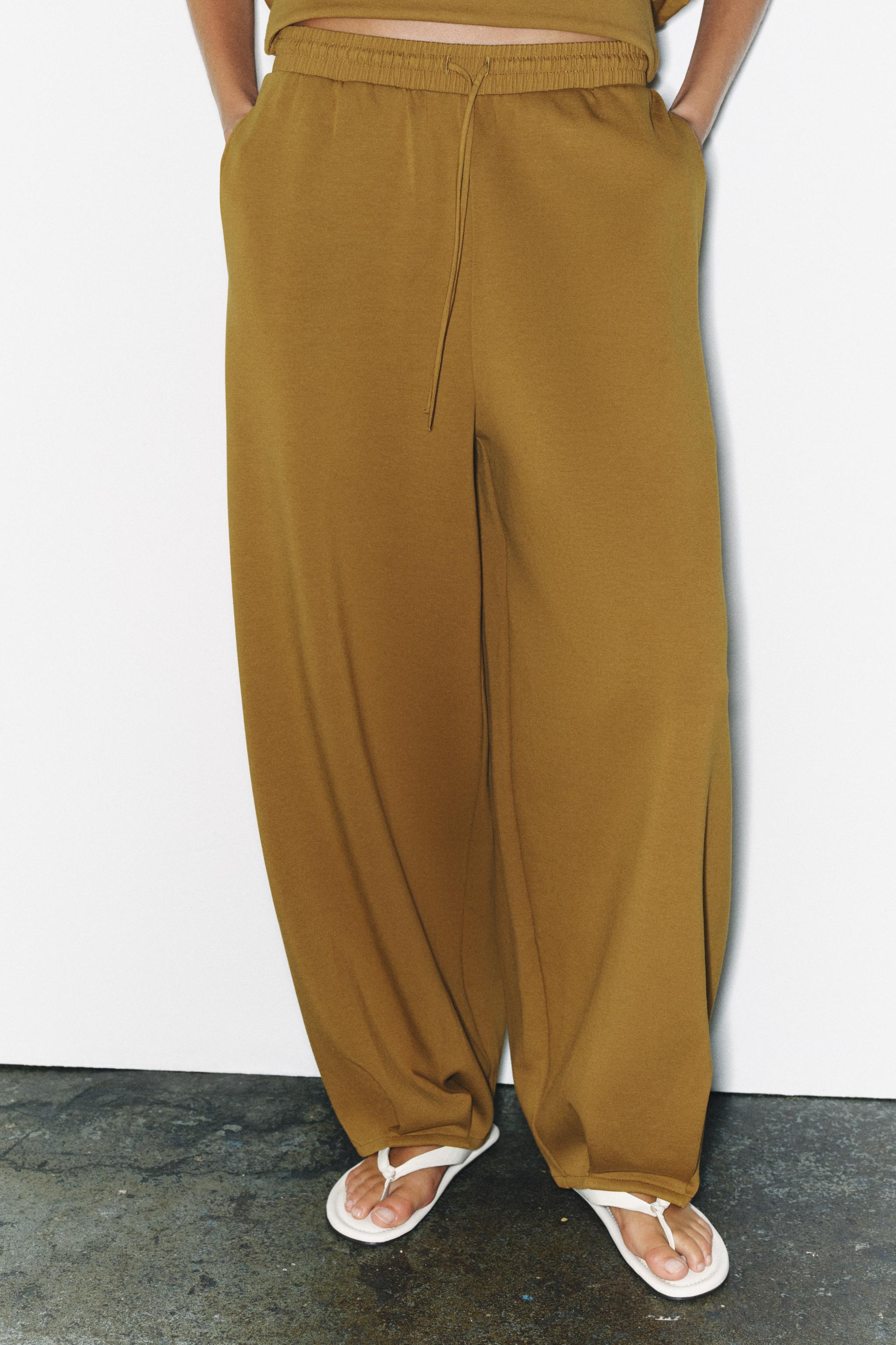 PLEATED TROUSERS