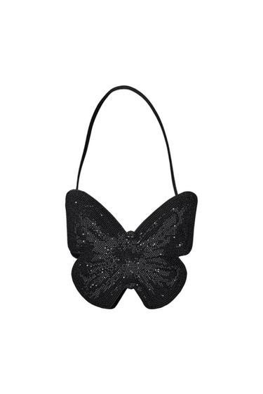 Front view of a black butterfly-shaped purse with sparkling details.