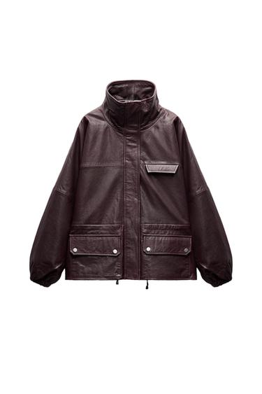 Front view of a dark brown jacket with front flap pockets and a high collar.