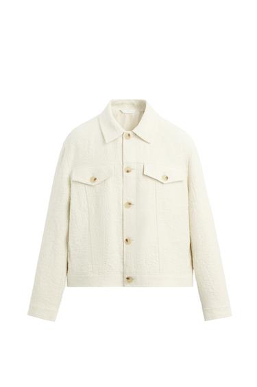 Front view of a white jacket with buttons and flap pockets.