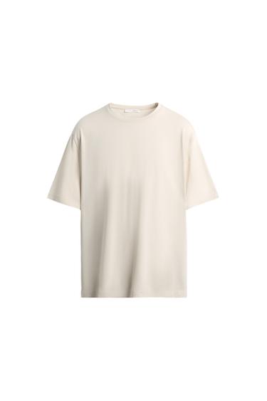 Front view of a cream-coloured regular fit T-shirt, with a round neck and short sleeves.