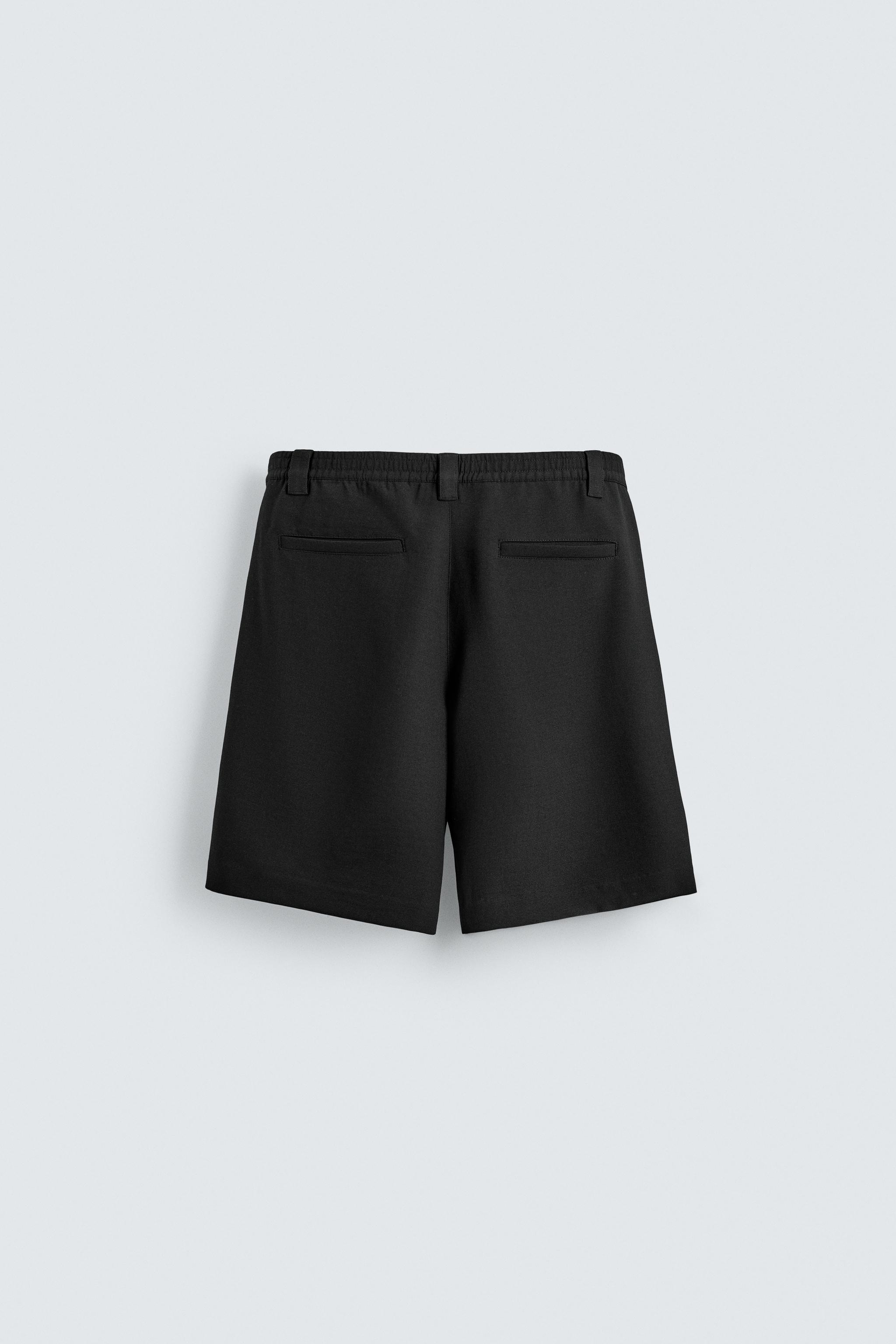 RELAXED FIT SIDE PLEAT SHORTS