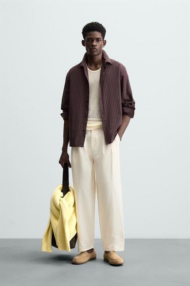 PANTALÓN CHINO PLIEGUES - Tostado de Zara - Imagen 0