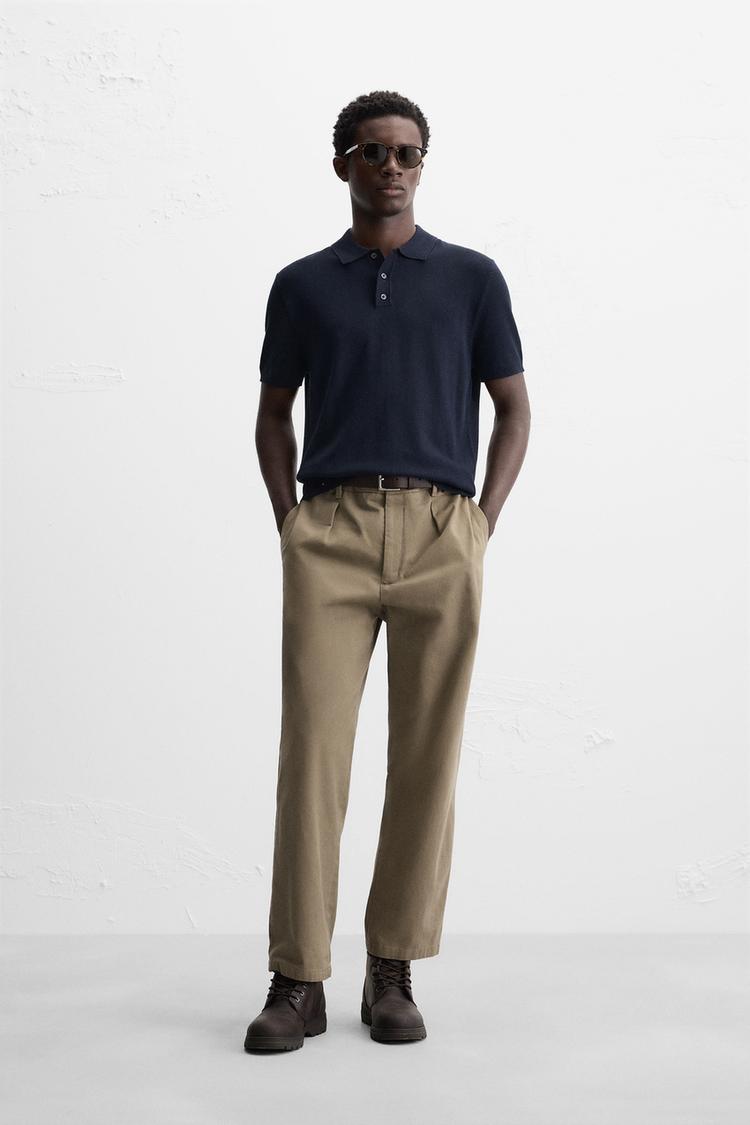 Knit polo shirt in viscose blend fabric. Lapel collar with front  