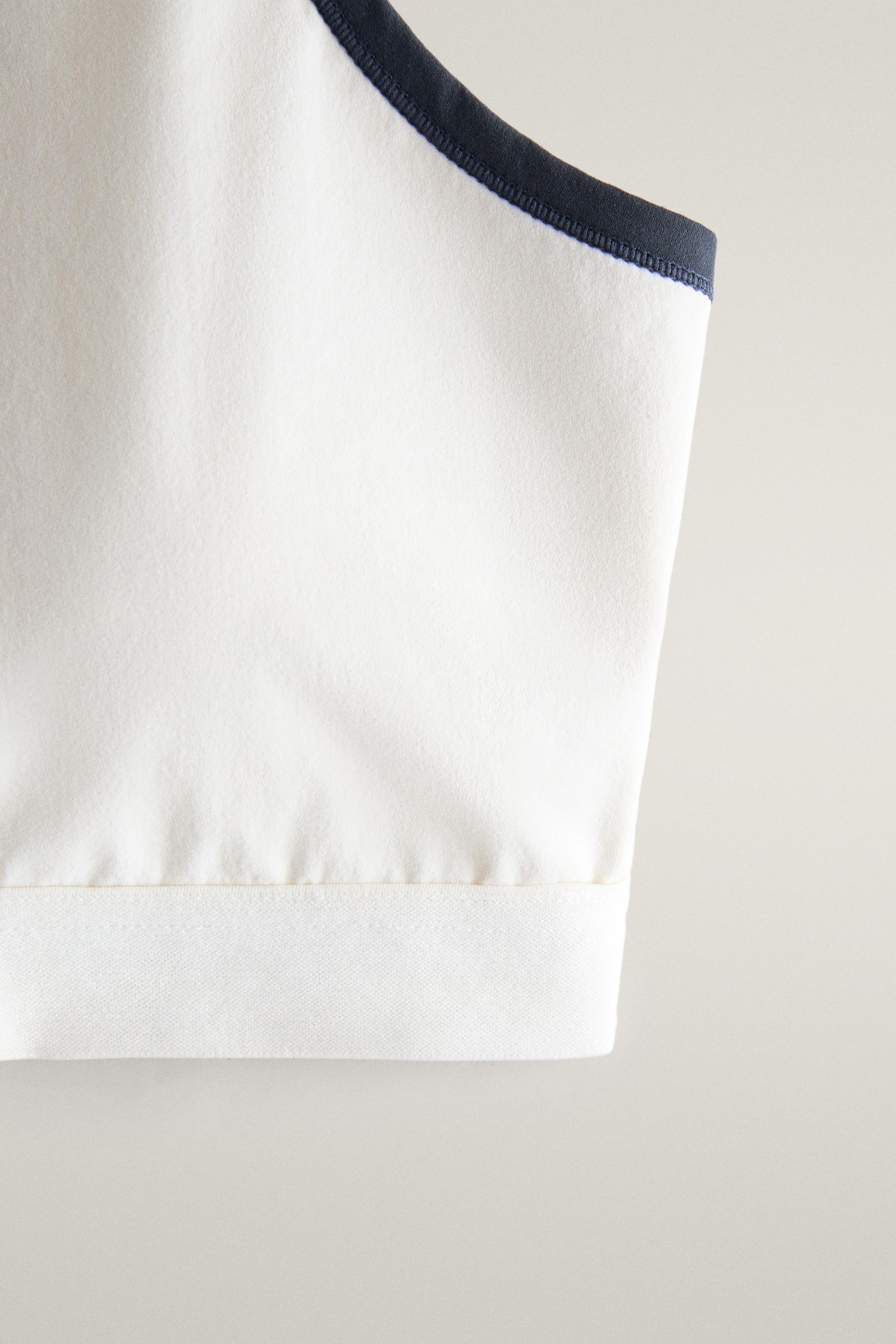 CONTRAST PIPING SPORTS TOP