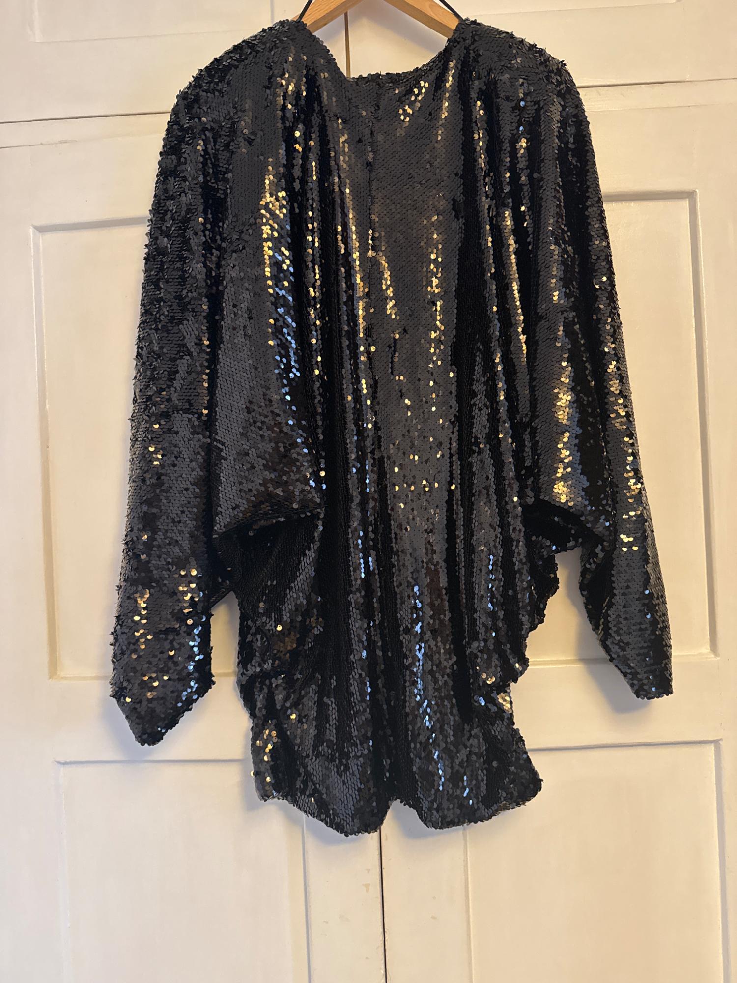 SEQUIN DRESS WITH A PLUNGING NECKLINE