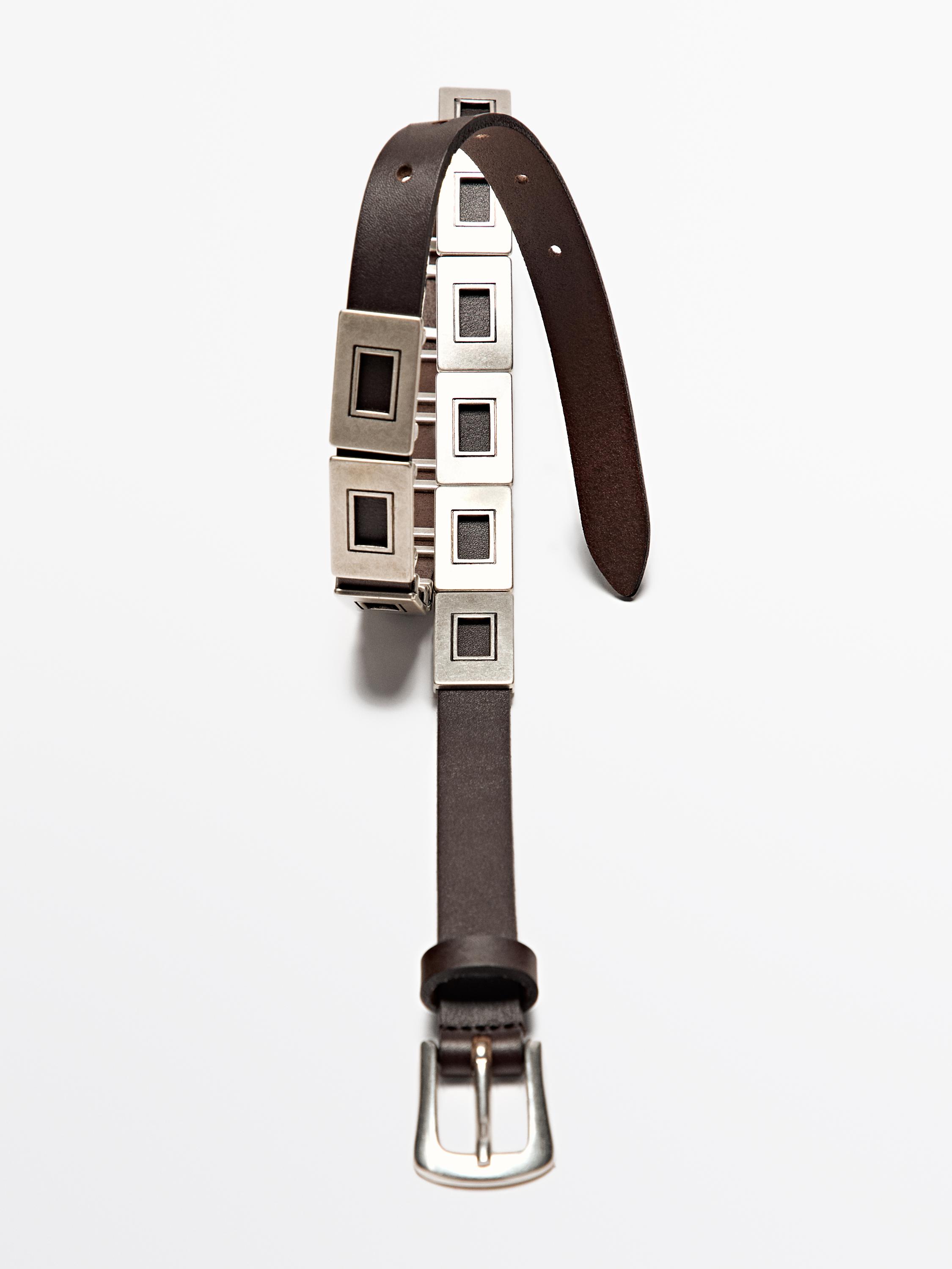 Belt with metal appliqués