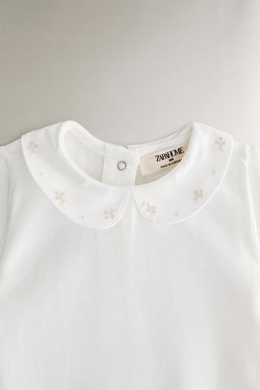 BAVOIR ENFANT BRODERIE FLEURS - Blanc cassé de Zara - Image 1