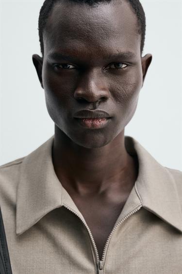 POLO TECHNIQUE À ZIP - Beige chiné de Zara