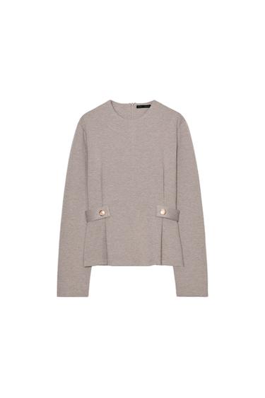 Front view of a mink sweatshirt with a round neck, long sleeves, and button tabs. Back zipper closure.