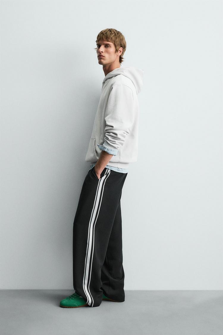 WIDE FIT JOGGER PANTS WITH SIDE STRIPES