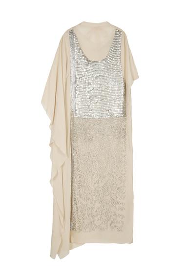 Beige dress with silver sequins on the front, loose design and wide sleeves, on a white background.