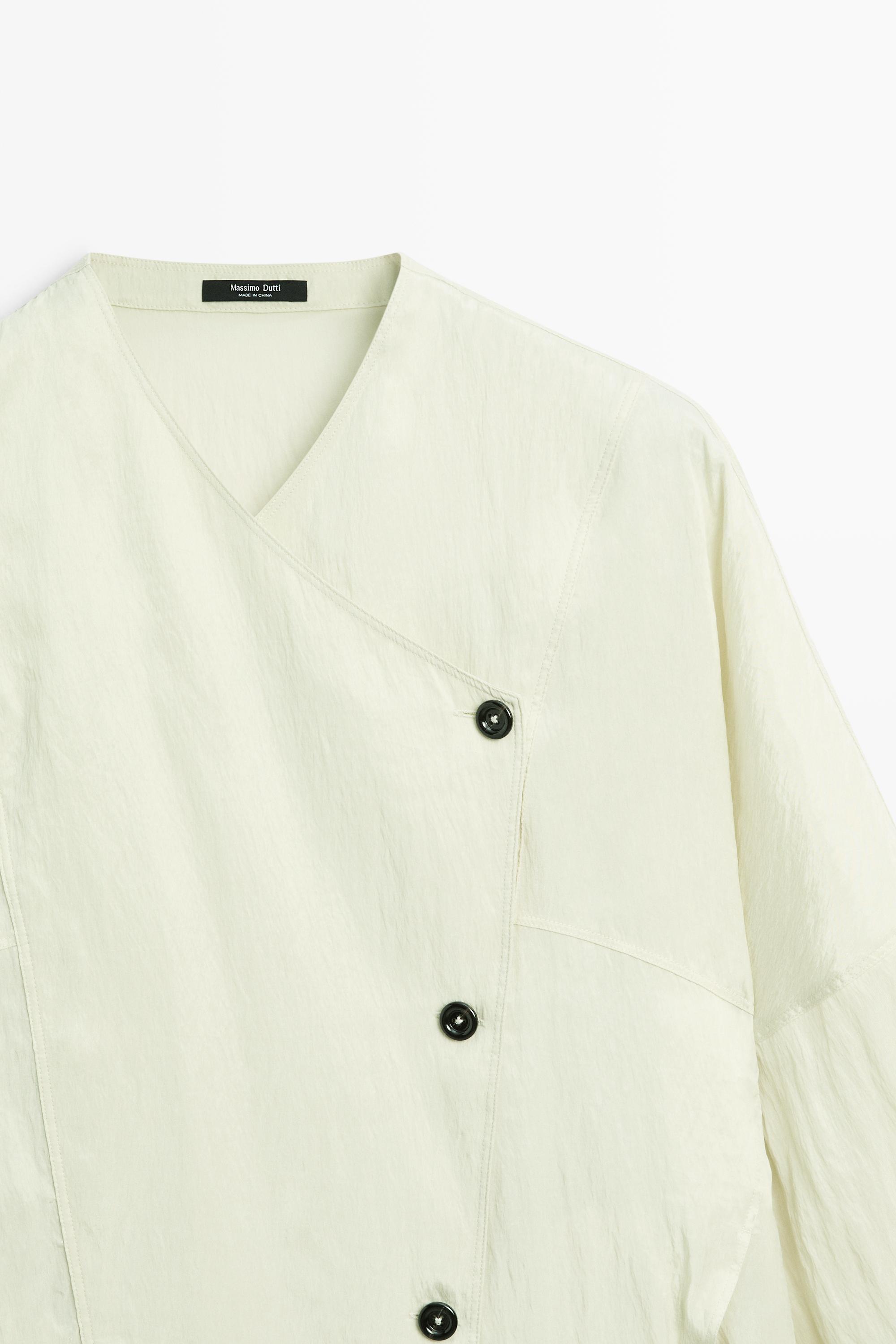 Fluid wrap shirt with button detail