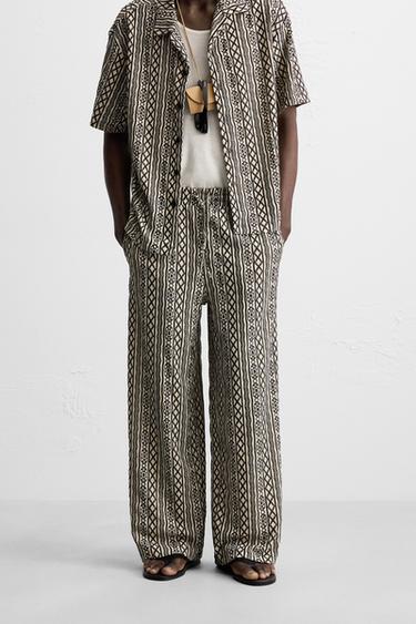 PERFORATED JACQUARD RELAXED FIT TROUSERS - Ecru / Black by Zara - Image 1