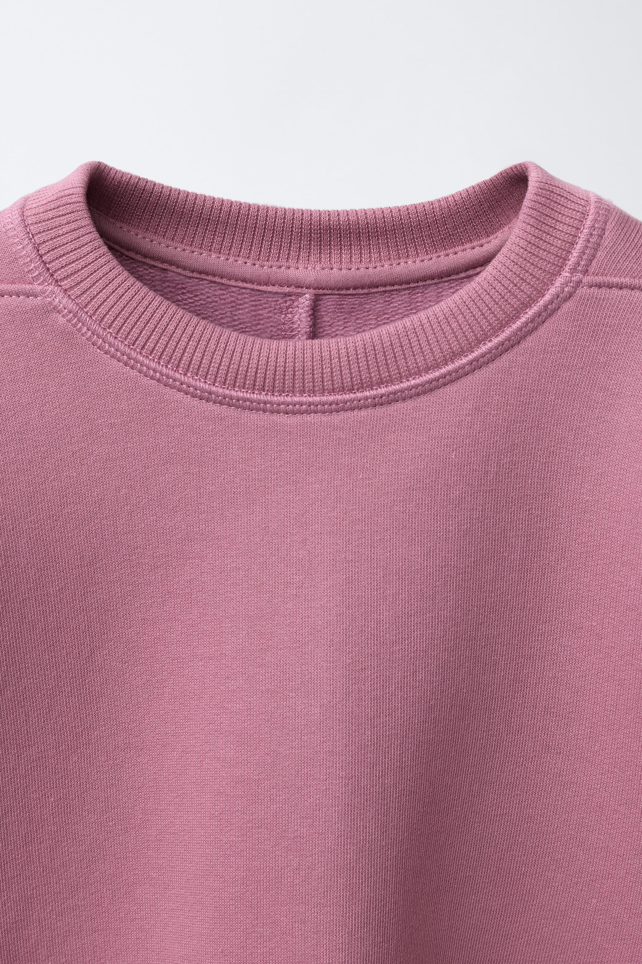 RAISED TEXT SWEATSHIRT