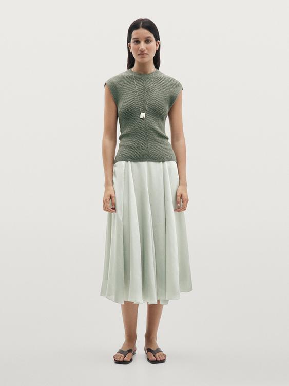 Sleeveless knit top with openwork details