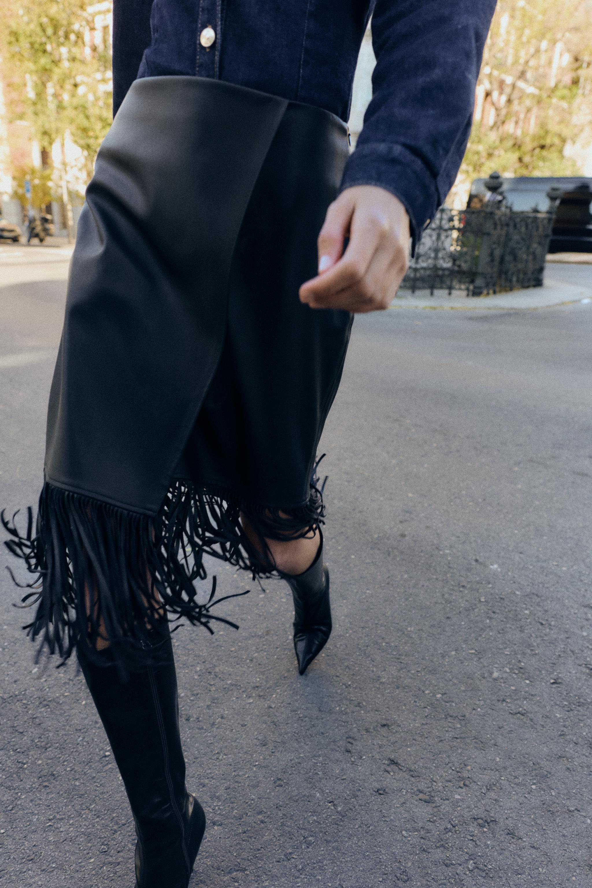 JUPE MI-LONGUE À FRANGES MATIÈRE SYNTHÉTIQUE