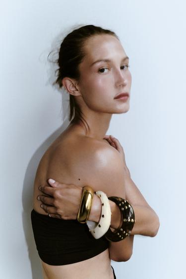 PACK 3 PULSERAS RÍGIDAS RESINA TACHAS - Dorado de Zara