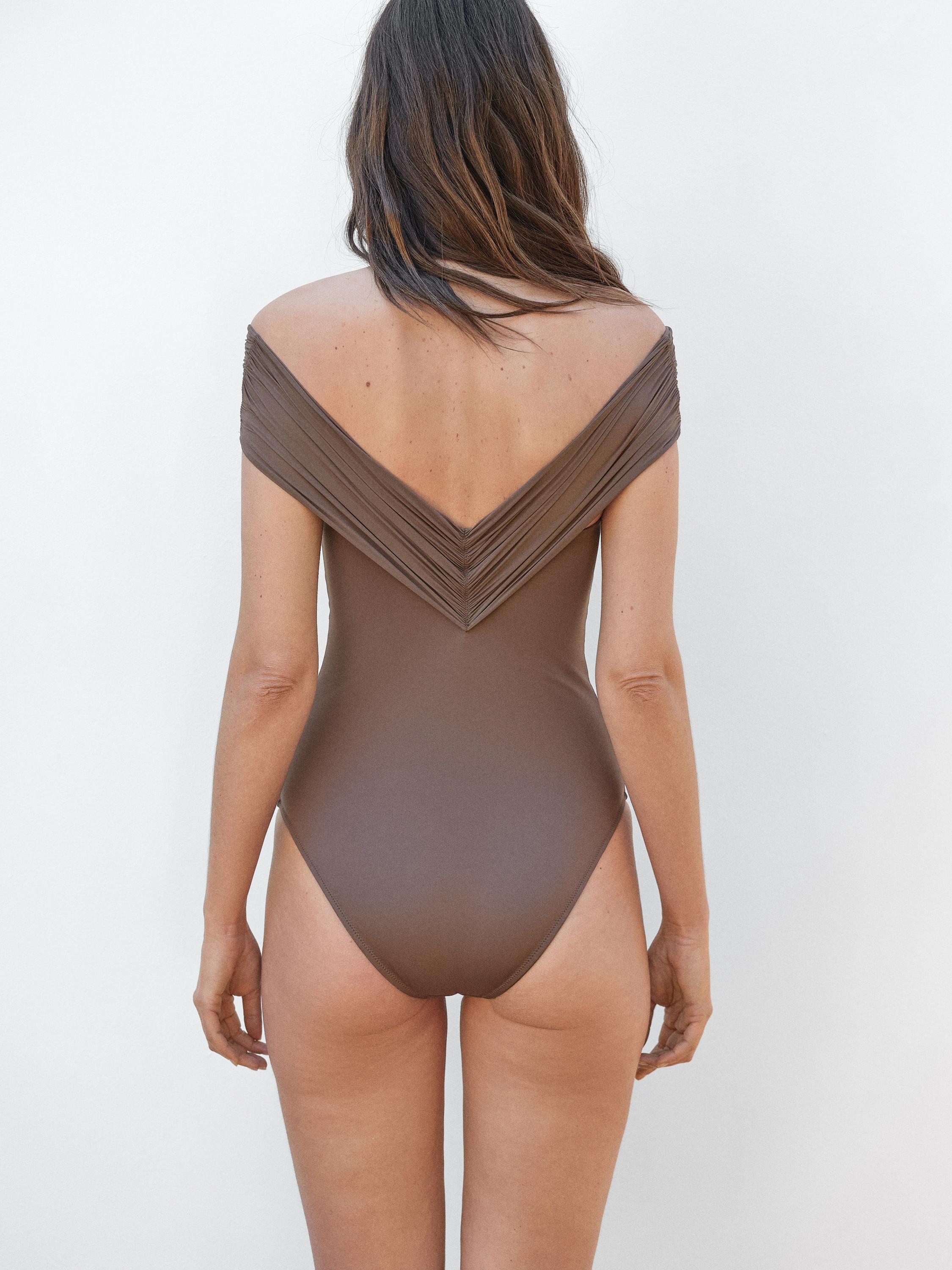 Bandeau swimsuit with criss-cross straps