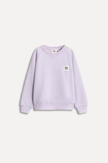 1/2-6 AÑOS/ SUDADERA BOLSILLO ETIQUETA 50TH ANNIVERSARY - Lila de Zara