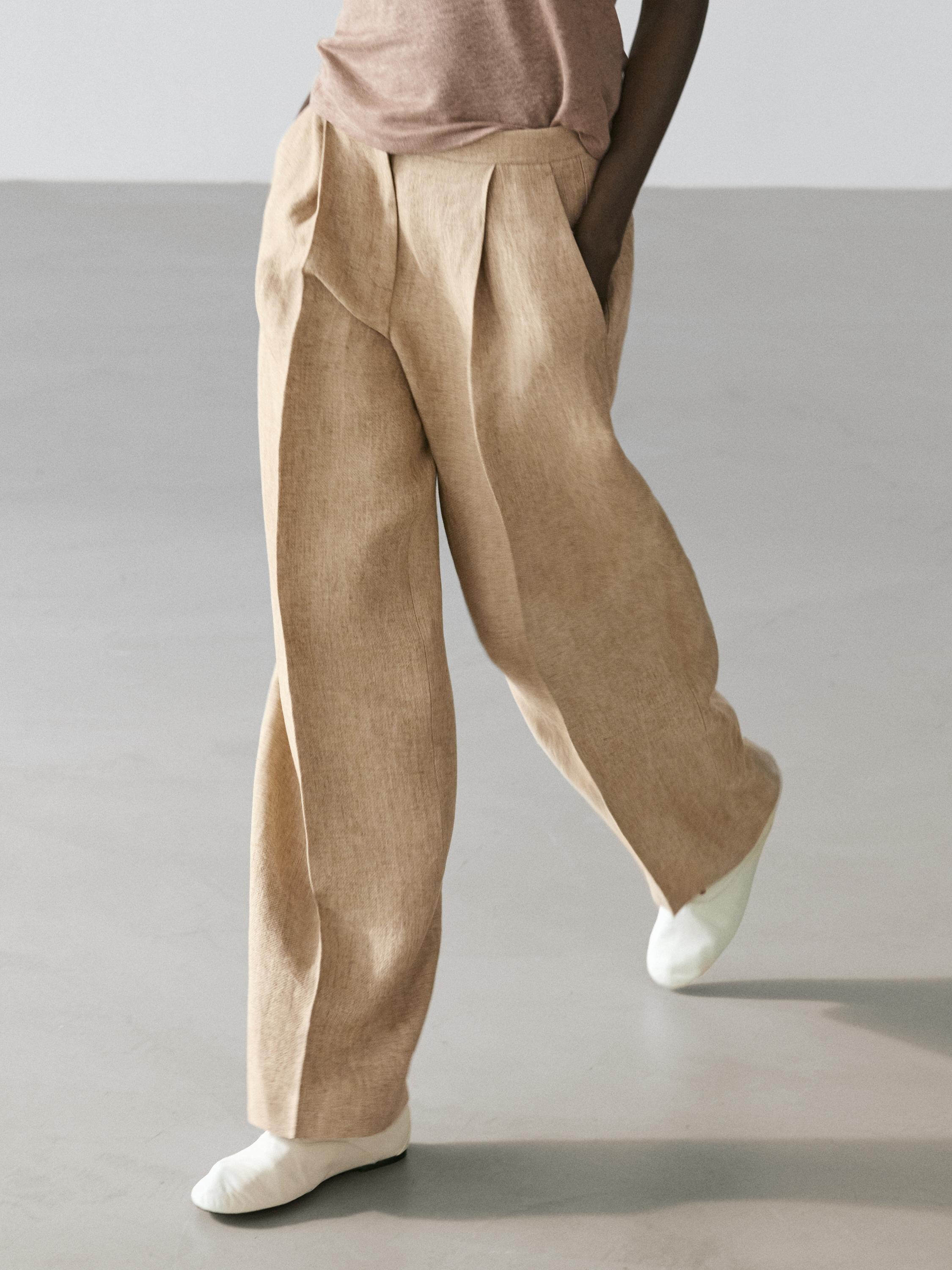 Flowing linen trousers with darts — Beige