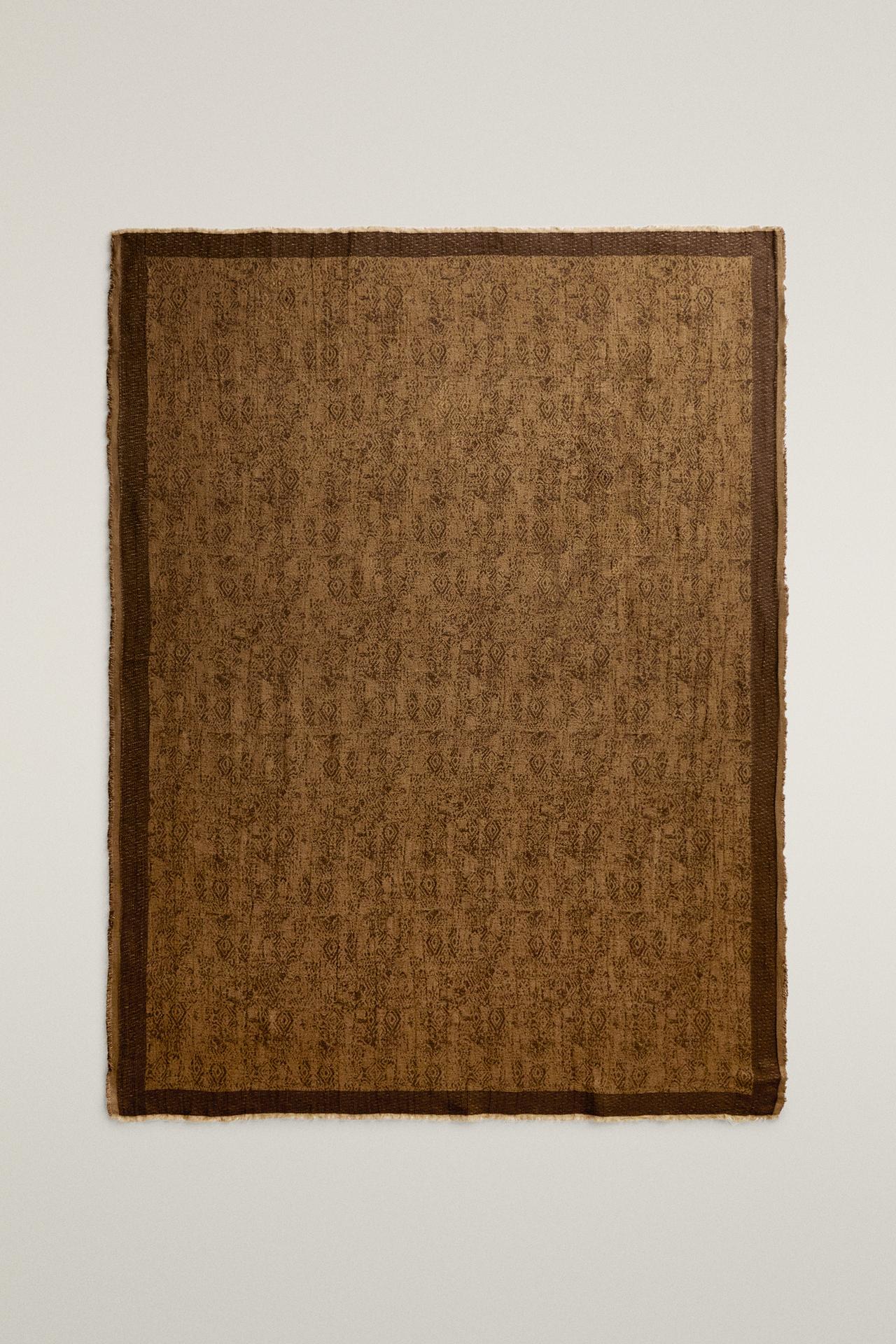 GEOMETRIC PRINT JACQUARD BLANKET WITH FRINGE