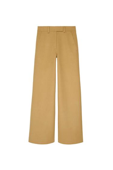 Beige wide-leg pants with side pockets and belt loops, on a white background.
