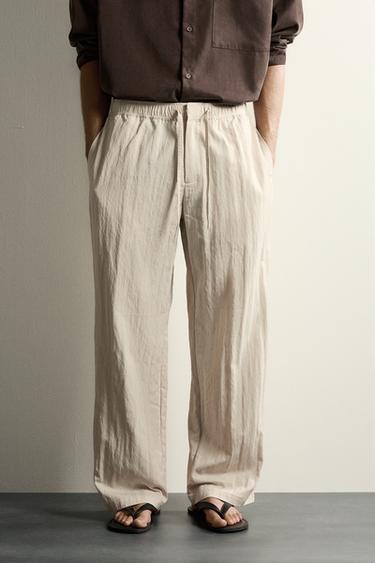 PANTALÓN TÉCNICO RELAXED FIT EFECTO ARRUGADO - Beige de Zara