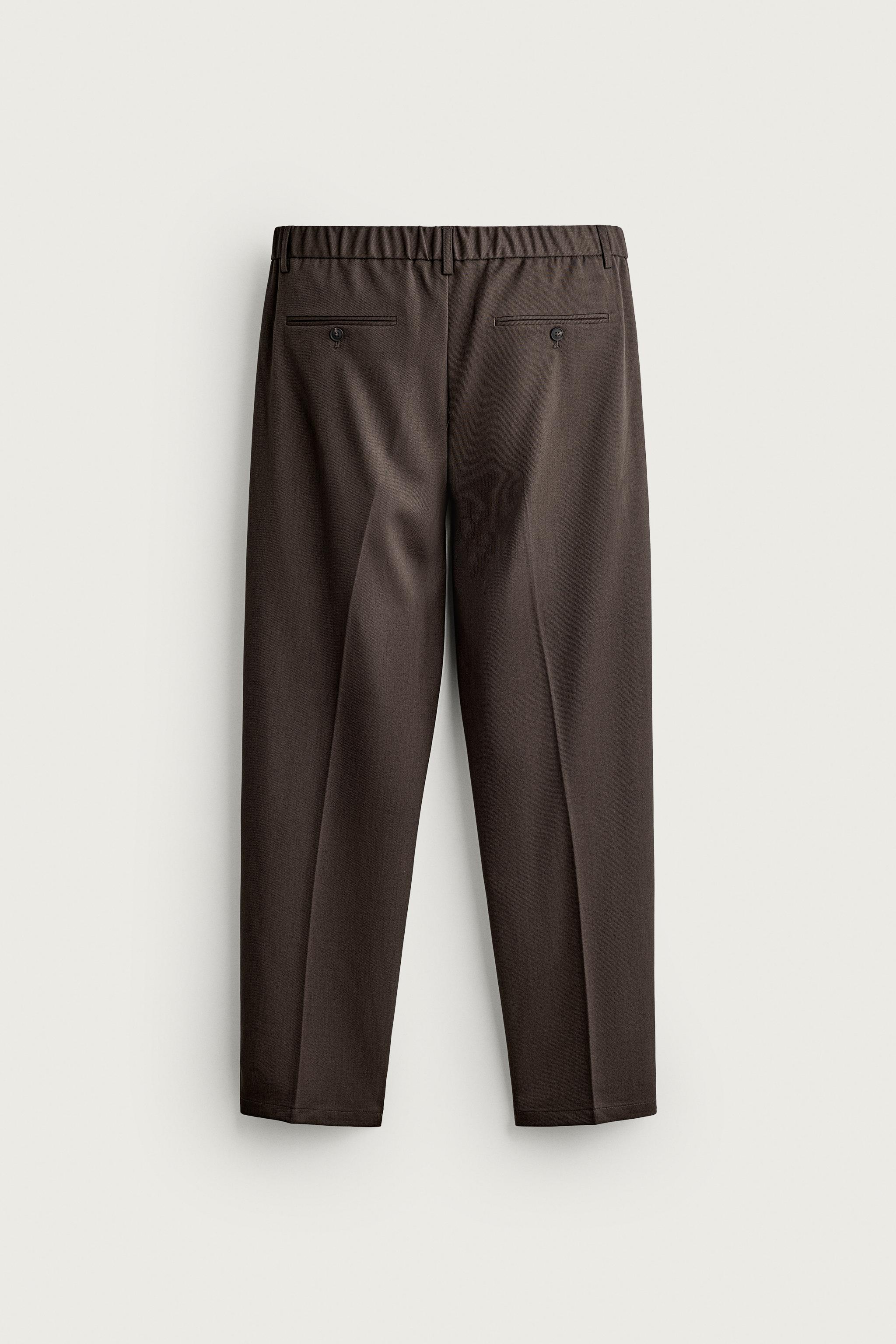SLIM FIT PLEATED PANTS