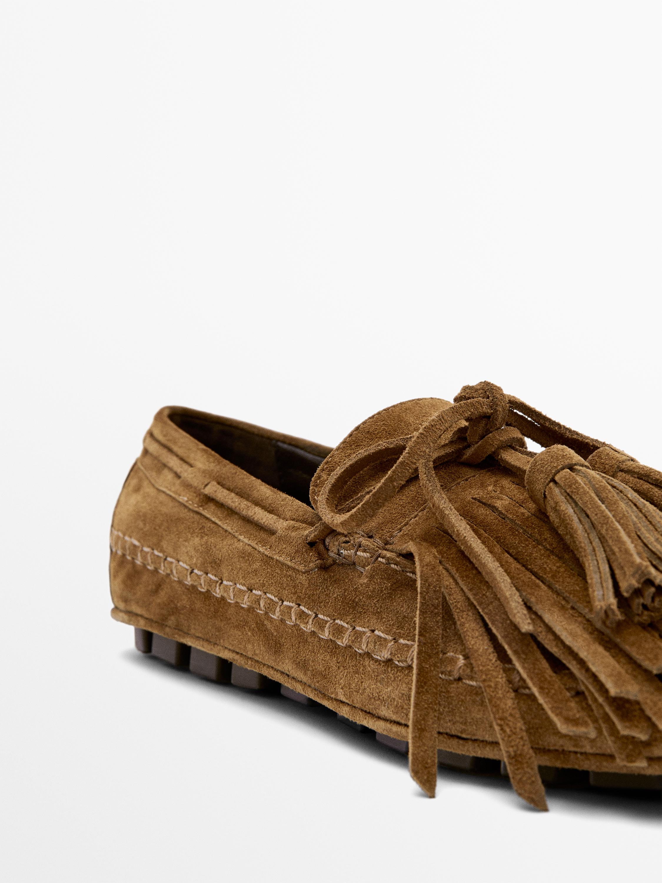 Split suede loafers with fringing and tassels