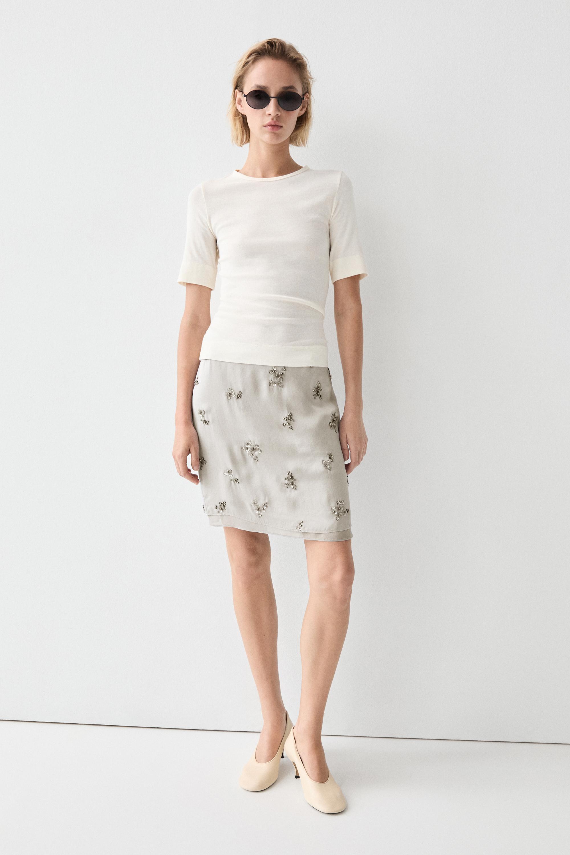 Mini skirt with beaded detail