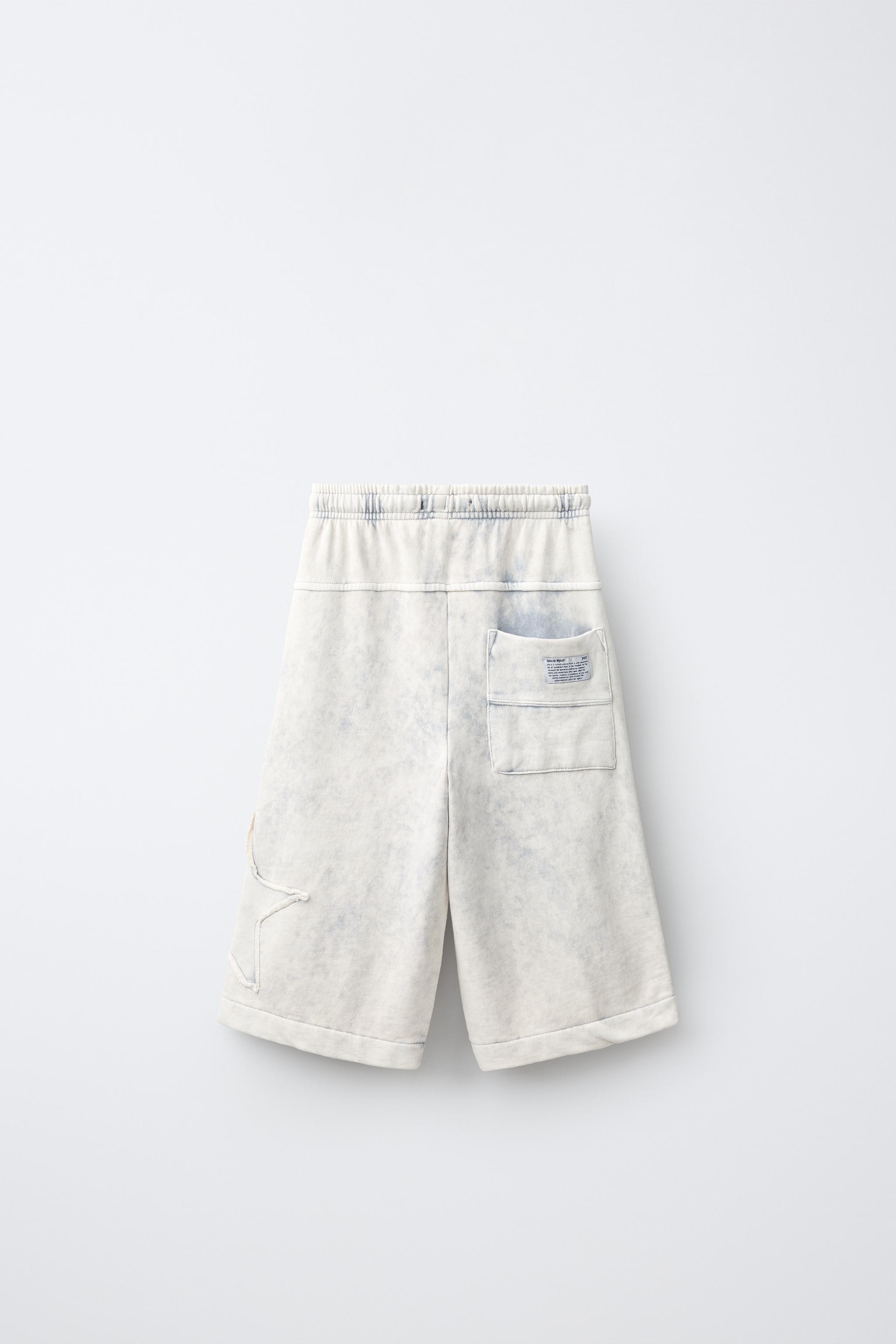 WASHED EFFECT STAR PATCH LONG BERMUDA SHORTS