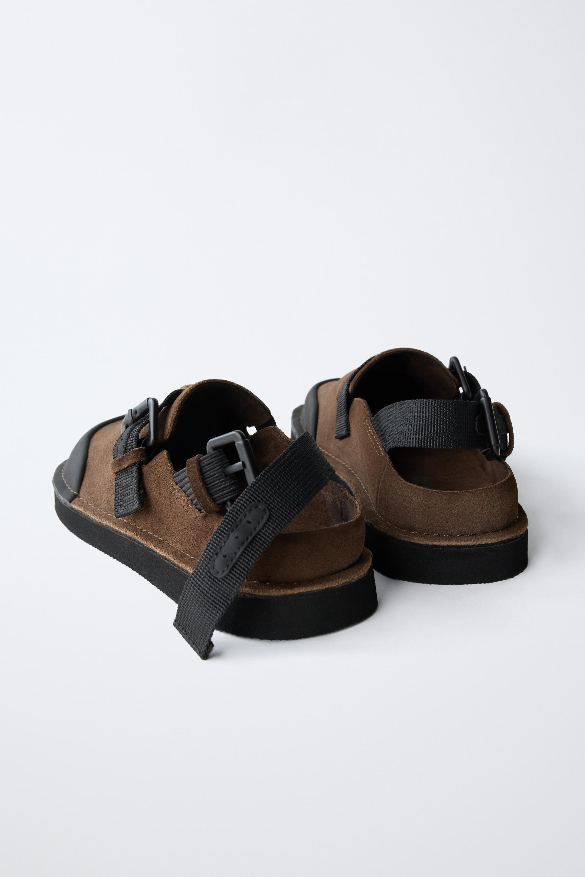 BUCKLED CLOGS