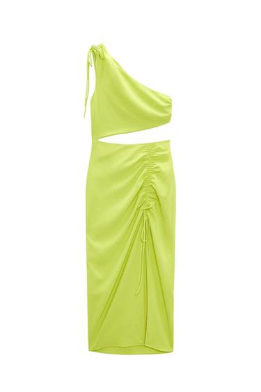 Lime green asymmetrical one-shoulder dress with a waist cutout and drawstring ruched skirt on a white background.