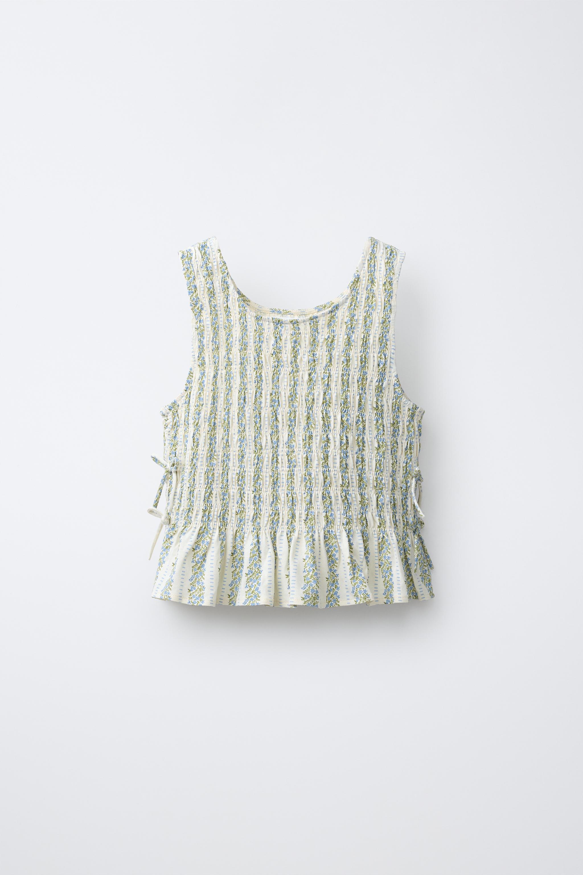 ELASTICIZED TIE TOP