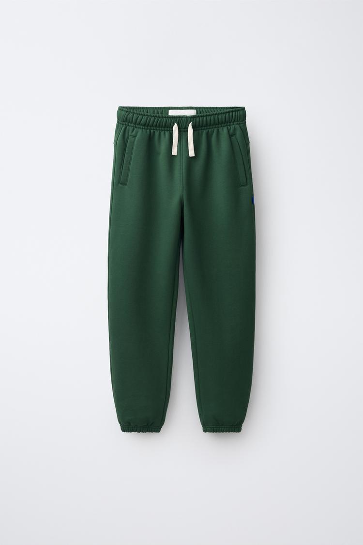 SOLID LABEL JOGGER PANTS — Bottle green