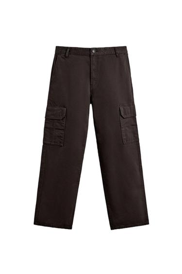 Front view of chocolate trousers with side cargo pockets and button and zip fastening.