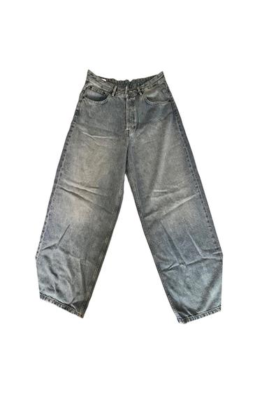 Light blue loose-fit, wide-leg jeans on a white background.
