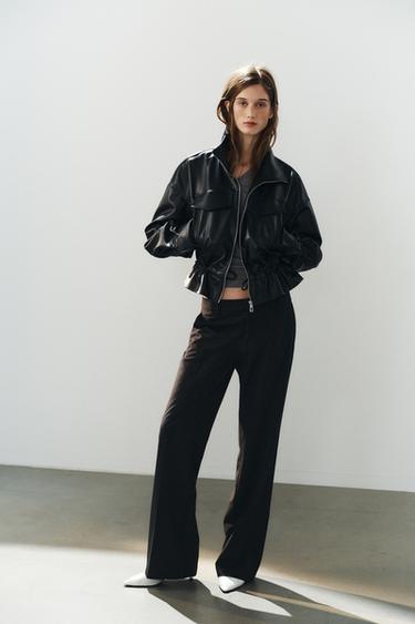 Chaqueta de efecto cuero con cintura ajustable