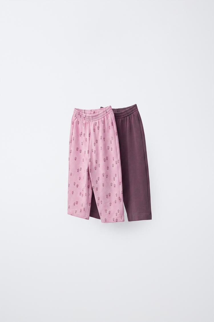 PACK DOS PANTALONES FELPA FLORES Y LISO