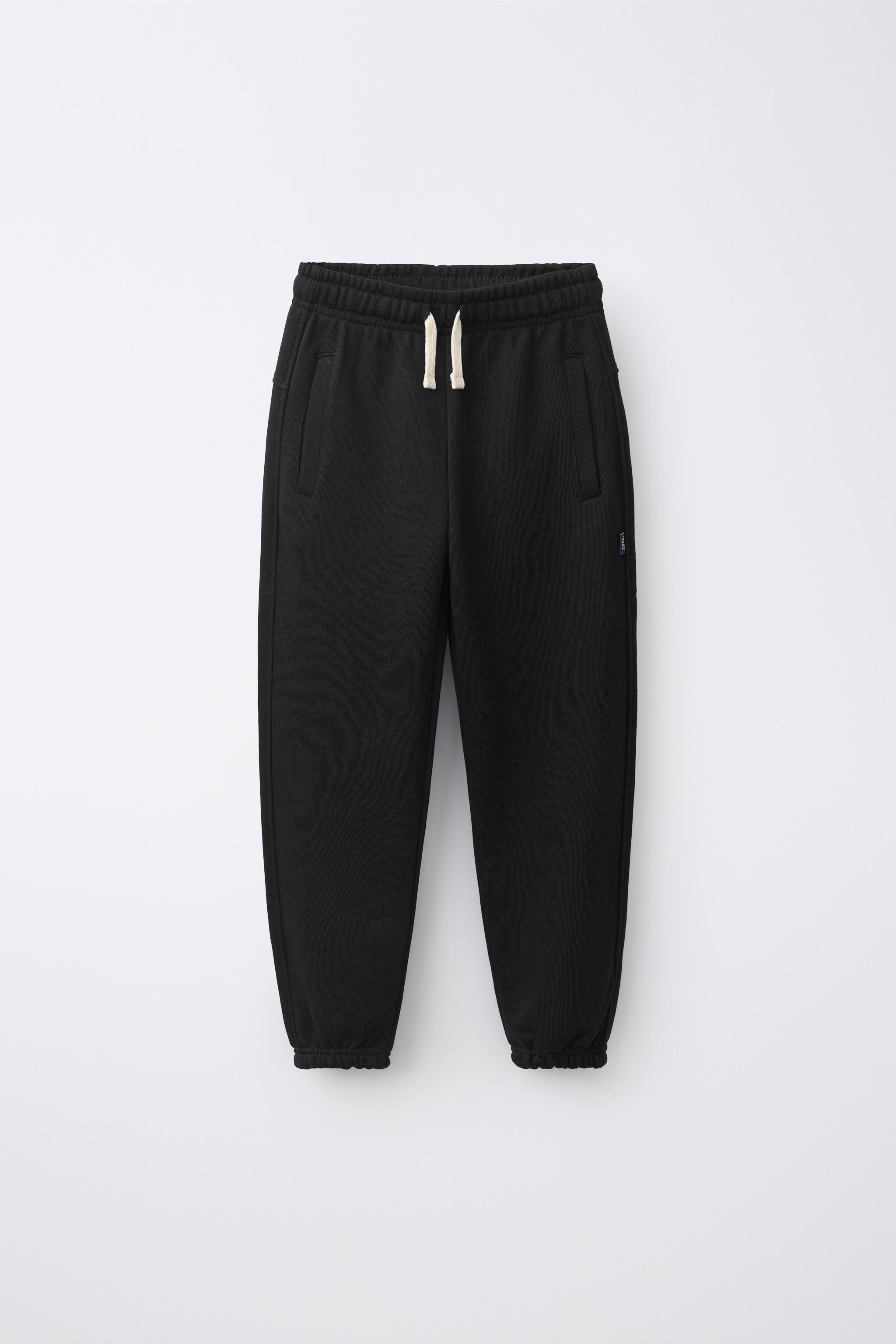SOLID FLEECE JOGGERS WITH LABEL — Black