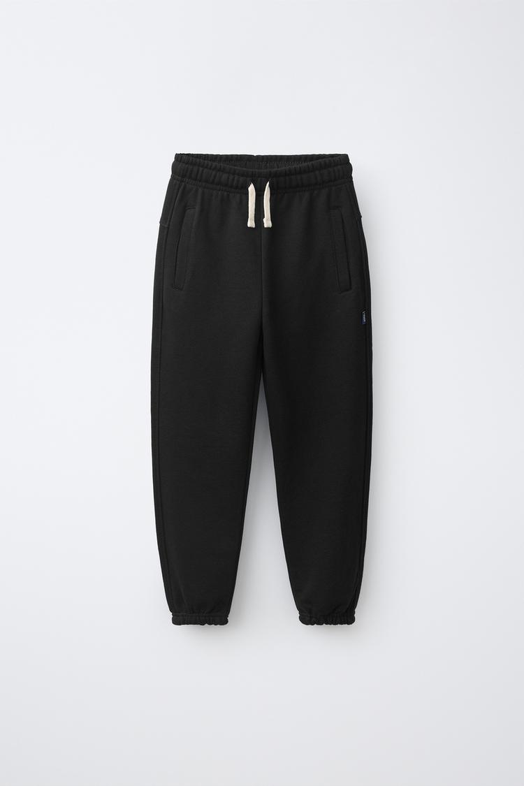 SOLID FLEECE JOGGERS WITH LABEL — Black