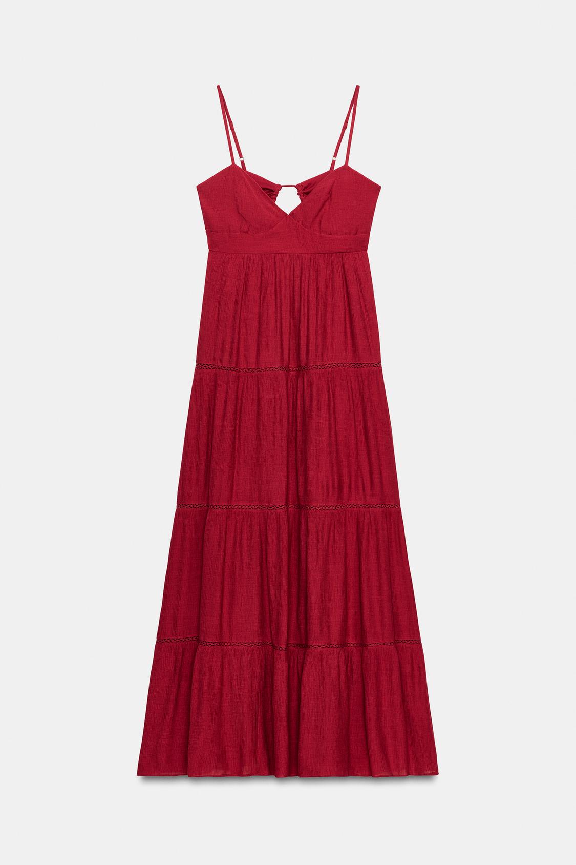 Front view of a long raspberry dress with a V-neck, adjustable spaghetti straps, lace inserts, and an open back.